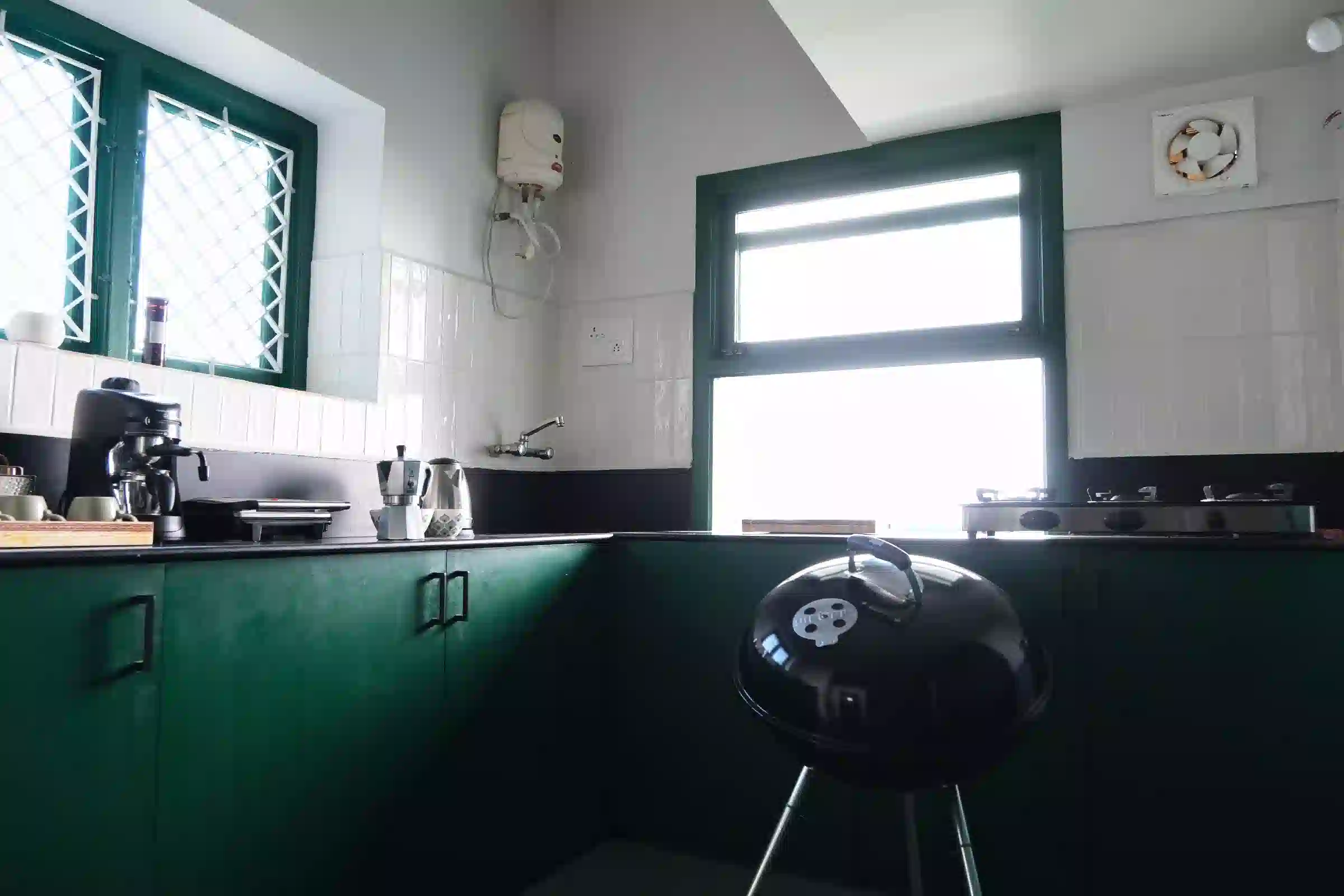 Fully equipped kitchen with barbecue setup at Cardamom Pods, Kodaikanal