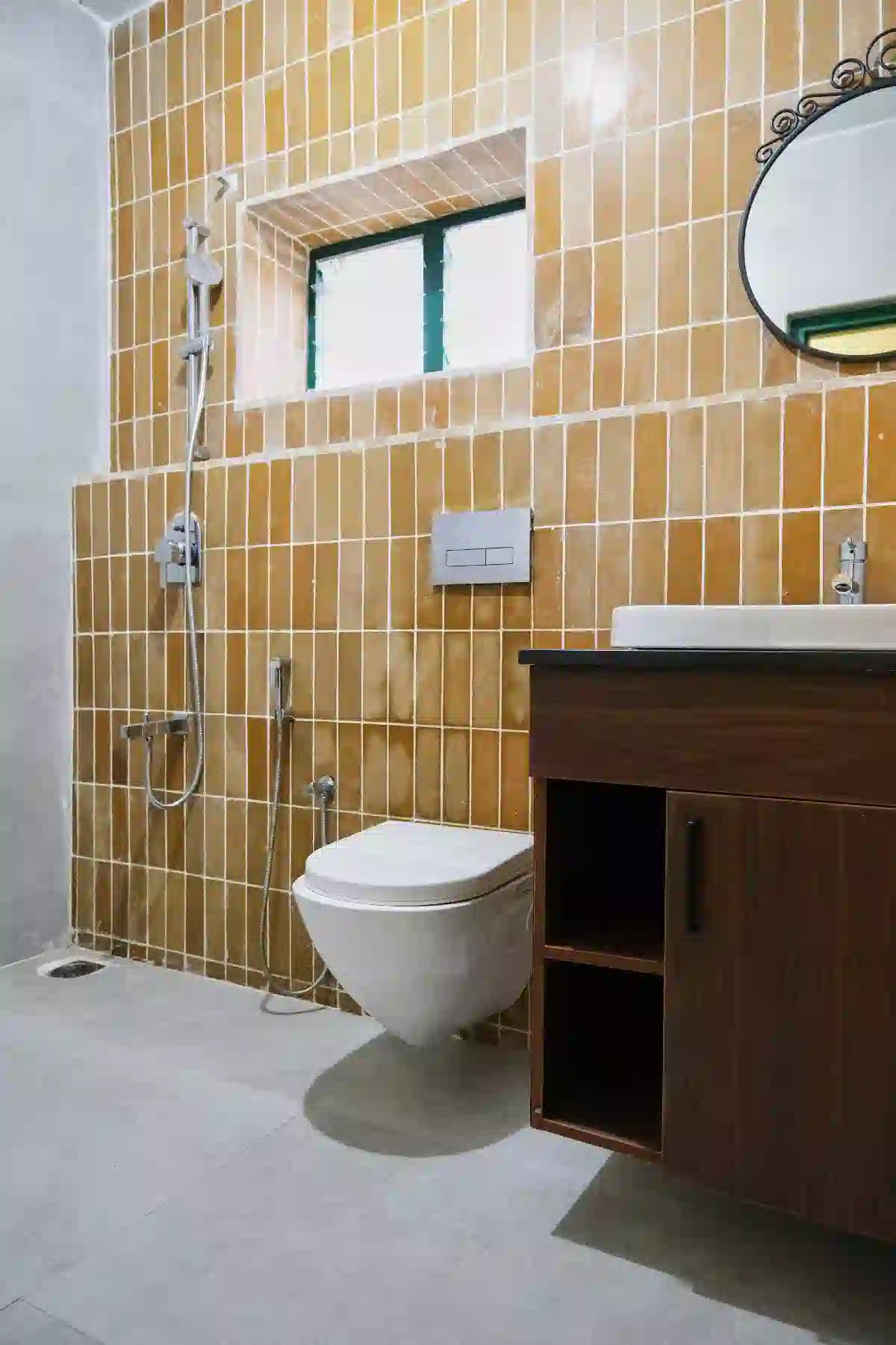 Modern attached bathroom with shower and vanity at Cardamom Pods, Kodaikanal